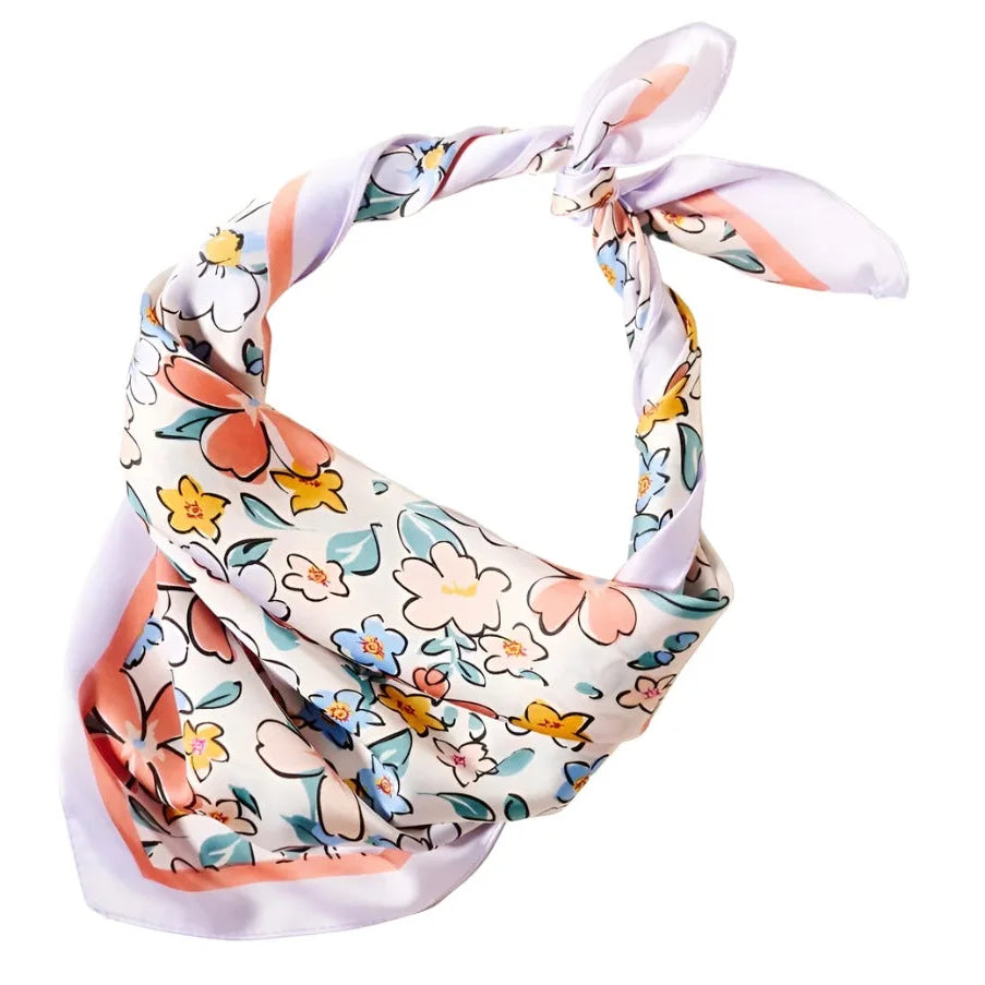 Floral Print Silk Scarf tied in a knot showcasing vibrant floral patterns