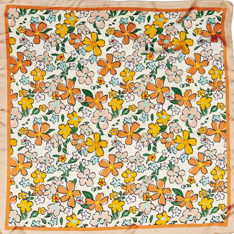 Floral print silk scarf featuring vibrant orange and yellow flowers on white background