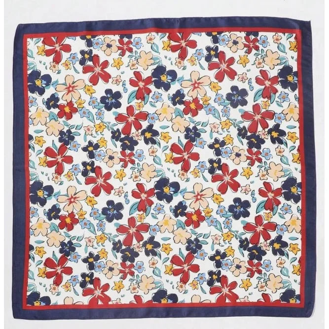 Floral print silk scarf with navy border featuring a vibrant floral pattern