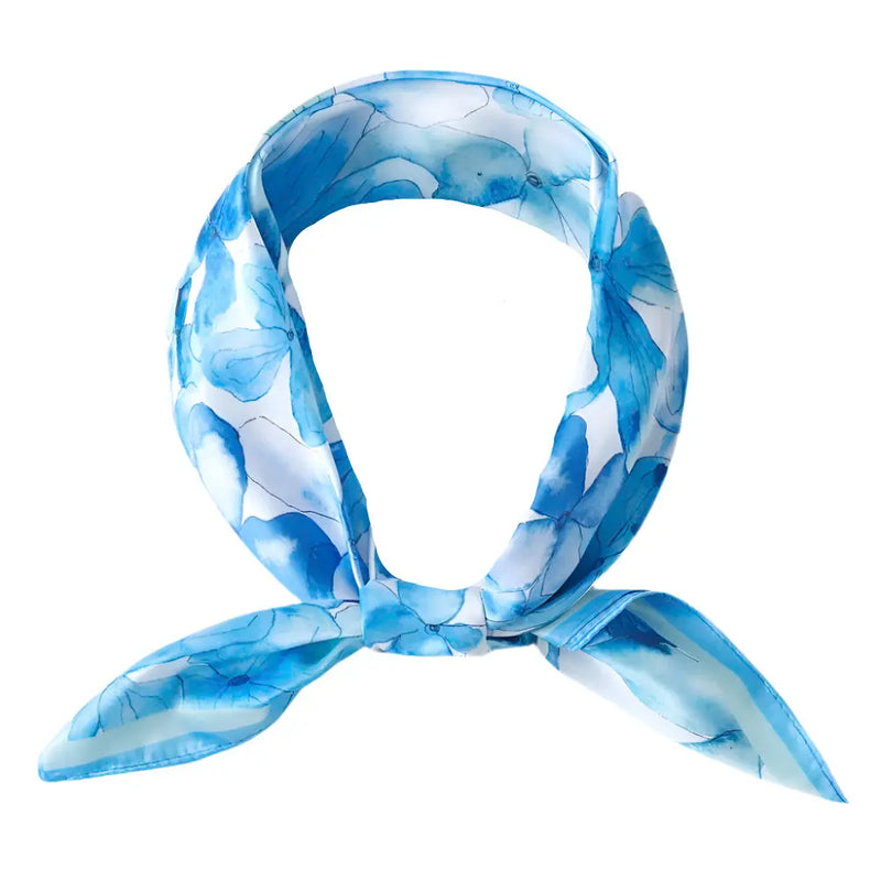 Light blue and white floral print silky bandana neck scarf tied in a loop