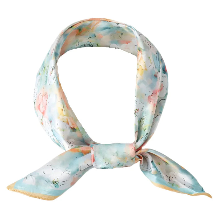 Silk scarf with pastel watercolor floral print, perfect for a stylish bandana neck