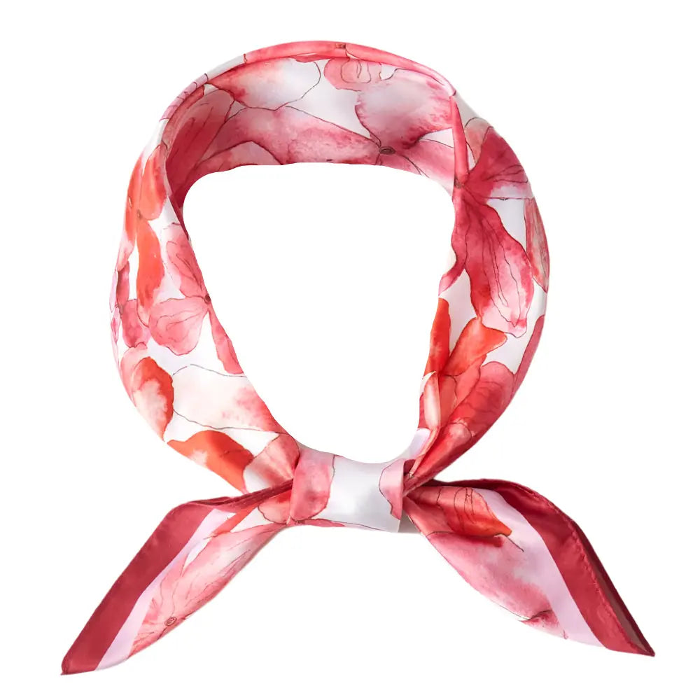 Pink and white floral print silky bandana tied in a stylish knot