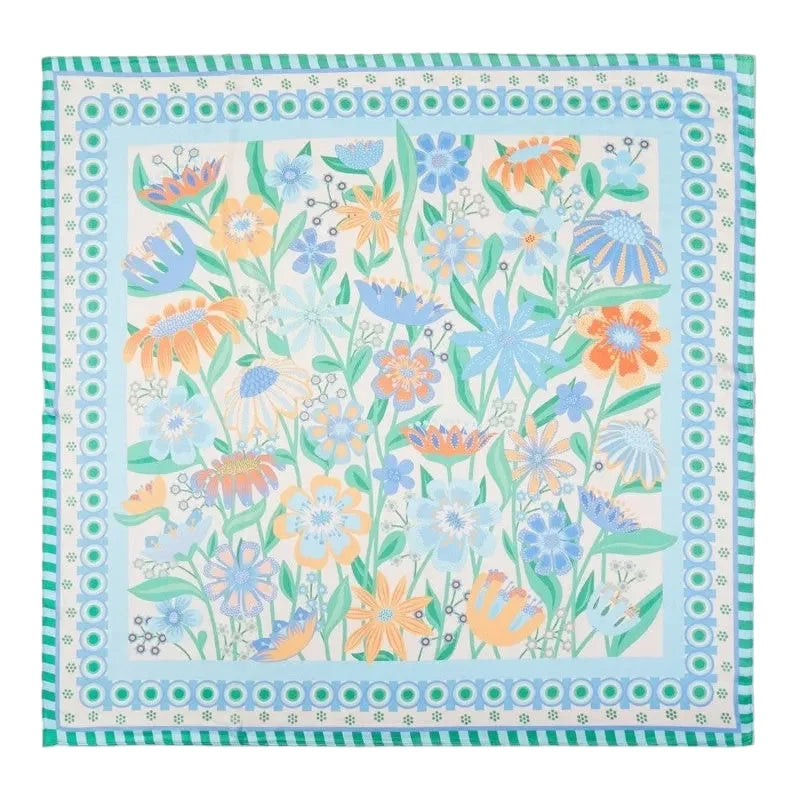 Floral patterned scarf with a border on a light blue background