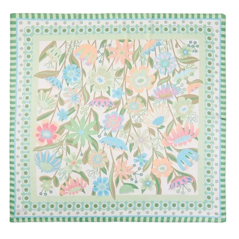 Floral patterned scarf with a green border on a white background