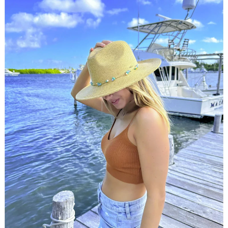 Straw sun hat featuring a turquoise beaded band for the Glass Bead Panama Hat