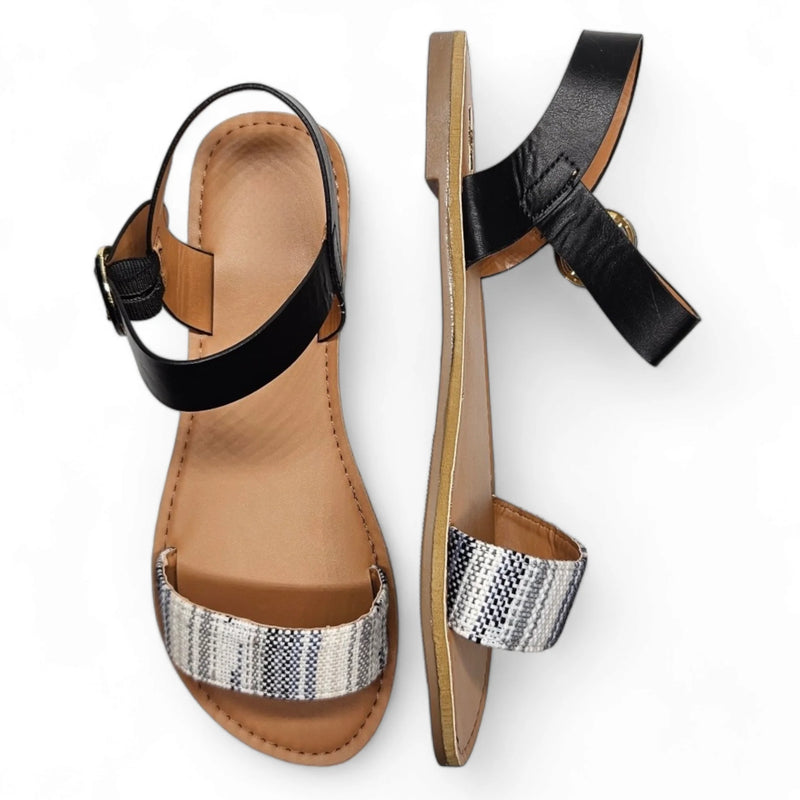 Pair of women’s Grey and White Sandals with black ankle and patterned front straps