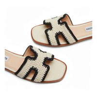 Cream-colored Steve Madden Hadyn sandals with black crochet H straps