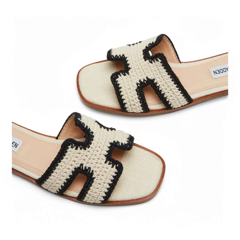 Cream-colored Steve Madden Hadyn sandals with black crochet H straps