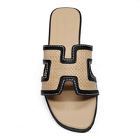 Beige and black Kansas Slip On Sandals featuring an H-shaped decorative element