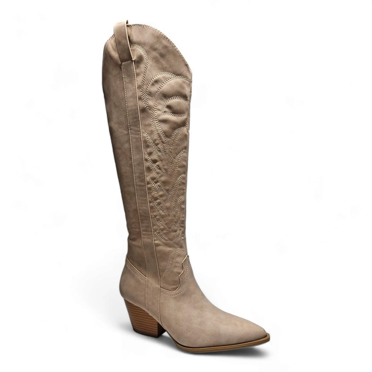 Tall beige leather knee high cowgirl boot features a pointed toe and stacked heel