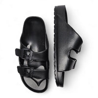 Pair of black leather double strap sandals with adjustable buckle straps perfect for summer