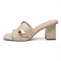 Beige leather band slide sandal with chunky heel and H-shaped cutout design