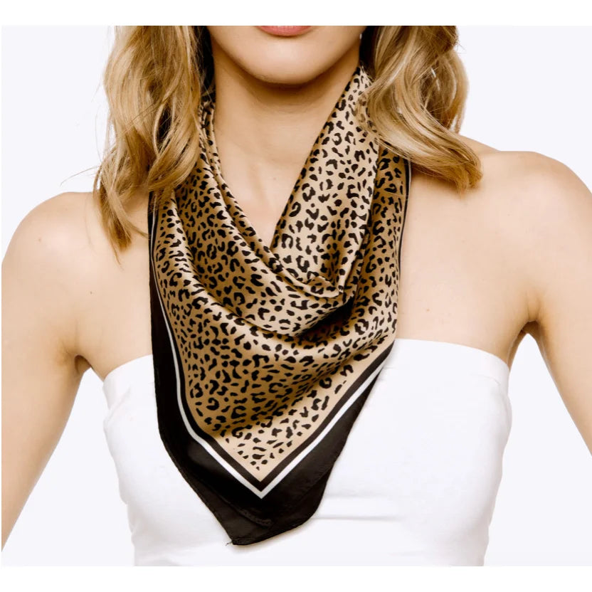 Leopard Print Silky Bandana draped stylishly around a neck over a white top