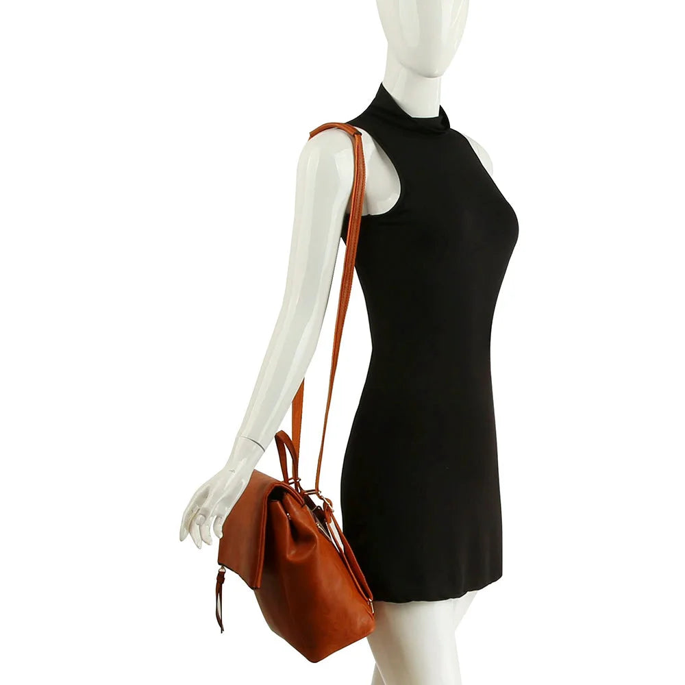 Sleeveless black mini dress on mannequin with Metro Flap Convertible Backpack