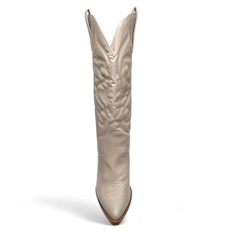 Tall white leather cowboy boot with western-inspired embroidered design and pointed toe