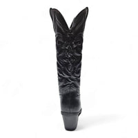 Black leather cowboy boot with western-inspired embroidered design and pointed toe