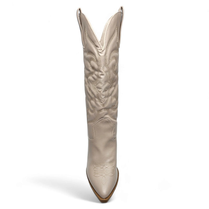 Tall white leather cowboy boot with western-inspired embroidered design and pointed toe