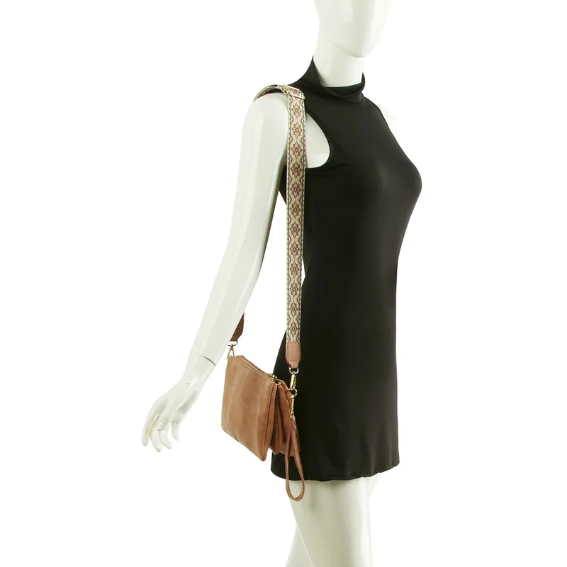 Black sleeveless mini dress on a mannequin with Multi Compartment Crossbody Bag displayed