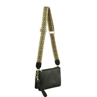 Black leather multi compartment crossbody bag with patterned guitar strap