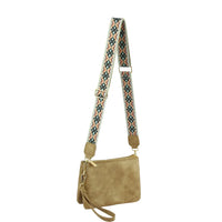 Beige suede multi compartment crossbody bag with colorful patterned guitar strap