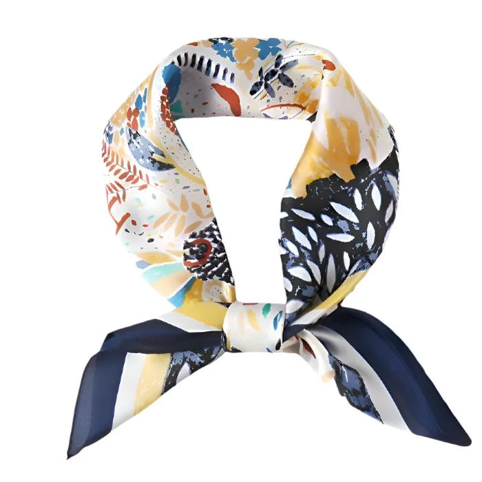 Colorful patterned silk scarf with abstract floral print tied in a stylish knot