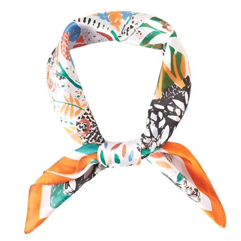 Colorful patterned silk scarf with abstract floral print tied in a knot