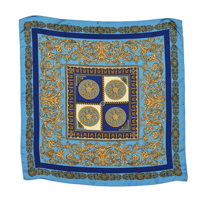 Decorative silk scarf showcasing ornate baroque patterns in blue and gold hues