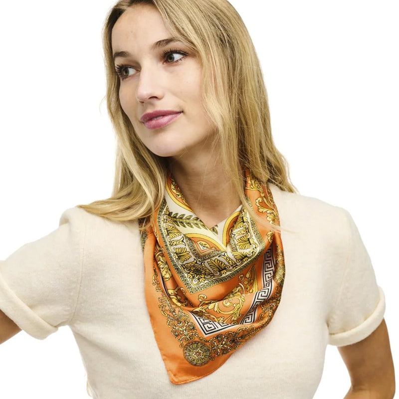 Orange and gold paisley design on a Multi Pattern Silky Square Neck Scarf