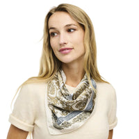 Patterned silk scarf featuring paisley and geometric designs in cream, gold, and gray tones