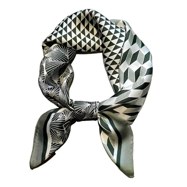 Silk multi print bandana scarf with geometric black and white patterns tied in a loop