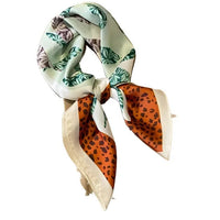 Elegant Multi Print Silk Border Scarf featuring floral and leopard print patterns