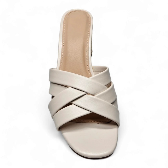 Cream-colored Mykonos Multi Strap Mule sandal with woven heel and crisscrossed straps