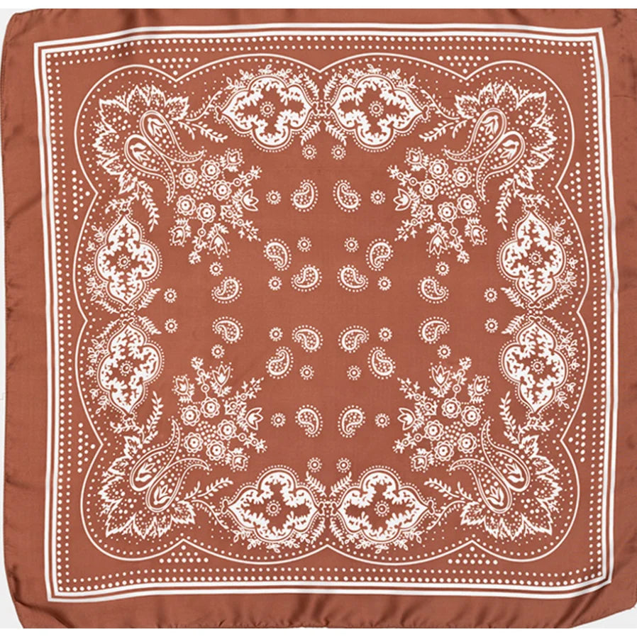 Rust-colored Paisley Silky Scarf featuring white paisley and floral patterns