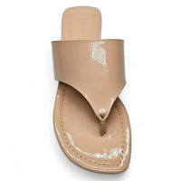 Beige leather thong sandal with wide strap, perfect for a stylish Patent Kitten Heel