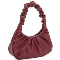 Burgundy leather wrinkle handle bag with gathered design and ruched handle