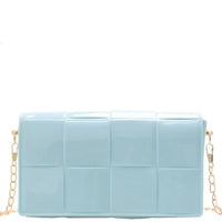 Light blue plastic quilted bag with gold chain strap for stylish elegance