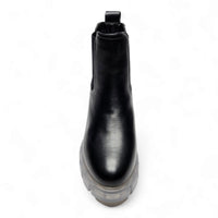 Black leather Chelsea boot with chunky lug sole, named Save The Planet Bootie