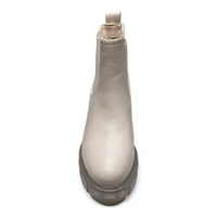 Frosted glass bottle with a curved shape and cap, enhancing Save The Planet Bootie lug sole