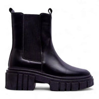 Black leather Puro Combat Boots featuring a chunky treaded sole for stylish comfort