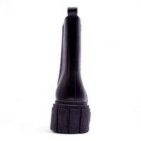 Black rubber flashlight with wide base complements Puro Combat Boots for outdoor adventures