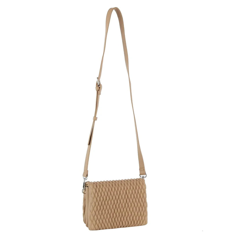 Beige quilted leather crossbody bag with adjustable strap for stylish versatility