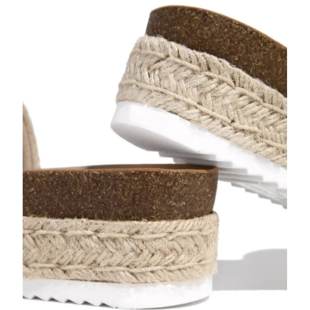 Sandal featuring cork sole, braided jute midsole, and white platform bottom in Raffia Platform Slide