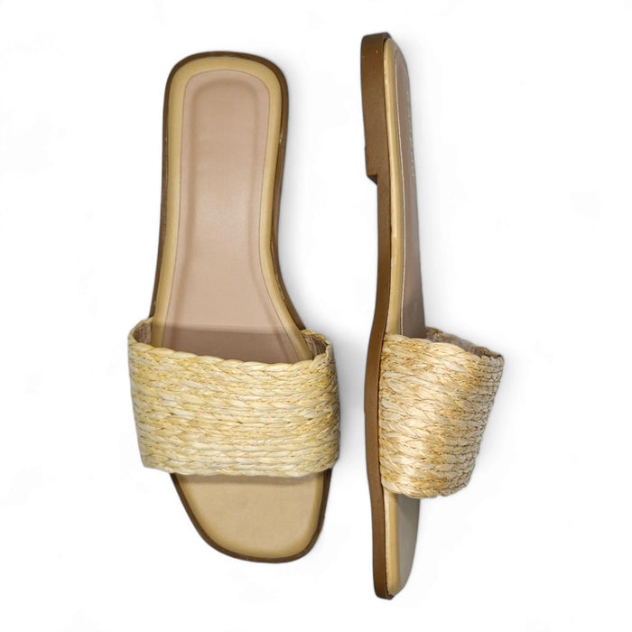 Pair of raffia slide sandals with woven straw design and flat soles