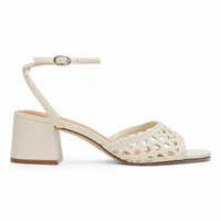 White sandal with open-toe and woven design on a white background