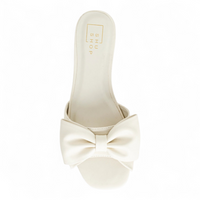White sandal with a large bow on a white background