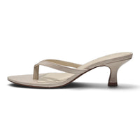 Ivory pointed-toe kitten-heel sandals, side view, slim toe-thong and ankle strap