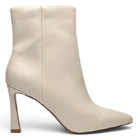 Ivory pointed toe ankle boot with side zip, tapered heel, and smooth finish