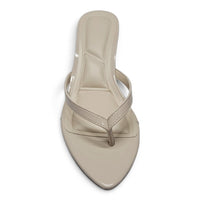 Ivory pointed-toe kitten-heel sandals with slim toe thong and ankle strap