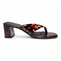 Tortoiseshell sandal with a block heel on a white background