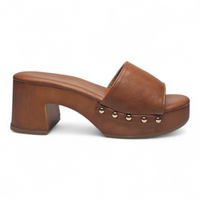 Brown leather clog shoe with block heel and decorative studs on a white background
